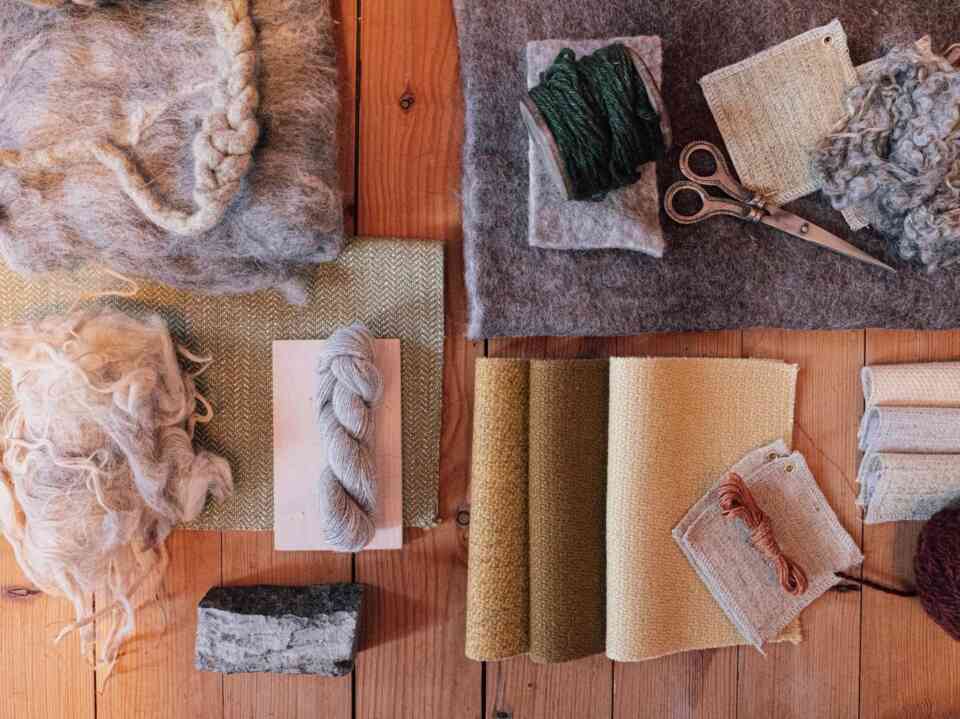 A palette of untreated wool fibres material samples and prototypes that form the starting point for exploring wool in architectural applications